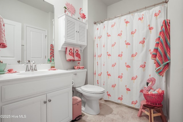 bathroom with vanity, a shower with shower curtain, and toilet