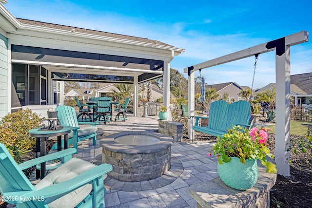 view of patio with an outdoor fire pit