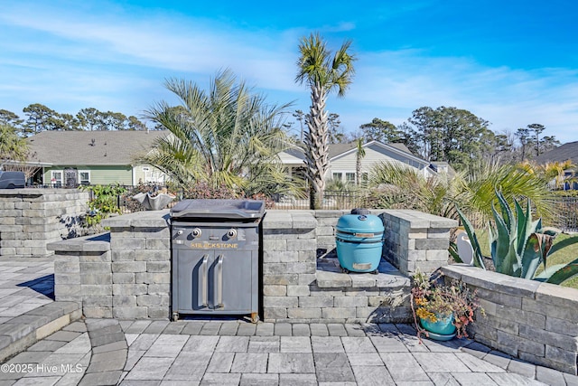 view of patio / terrace featuring exterior kitchen