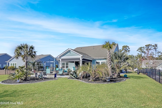 back of property featuring a lawn and a patio