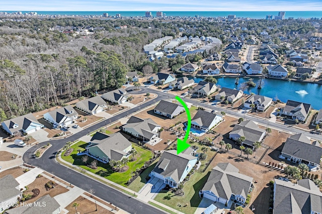 birds eye view of property featuring a water view