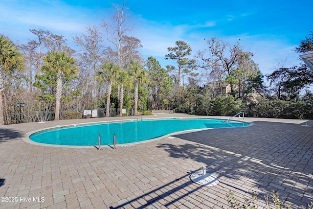 view of swimming pool featuring a patio