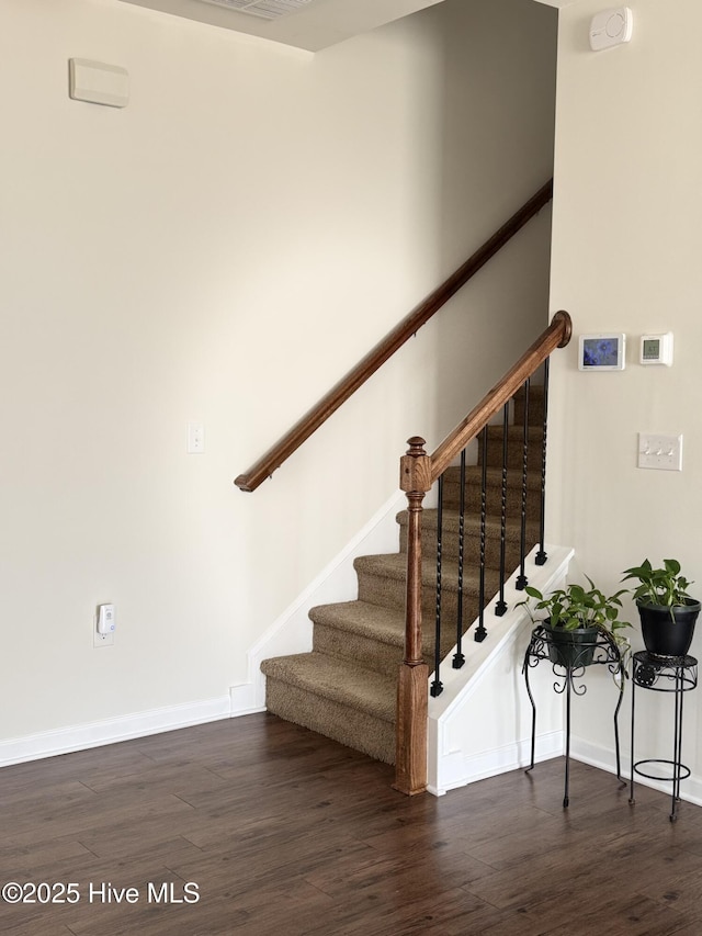 stairway with wood-type flooring