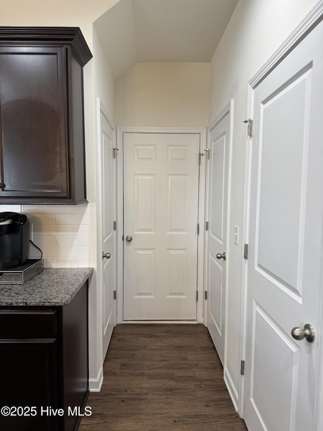 hallway with dark wood-type flooring