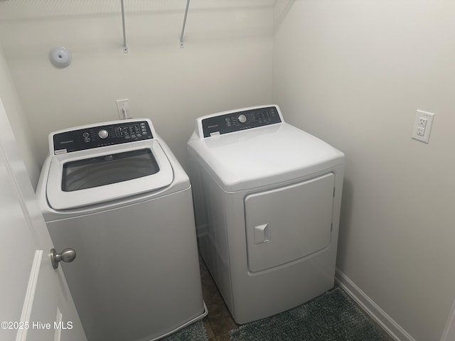 laundry room featuring washing machine and clothes dryer