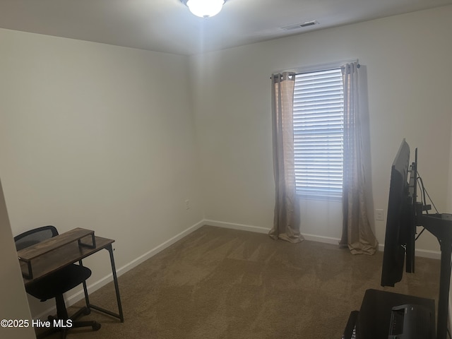 miscellaneous room with dark carpet