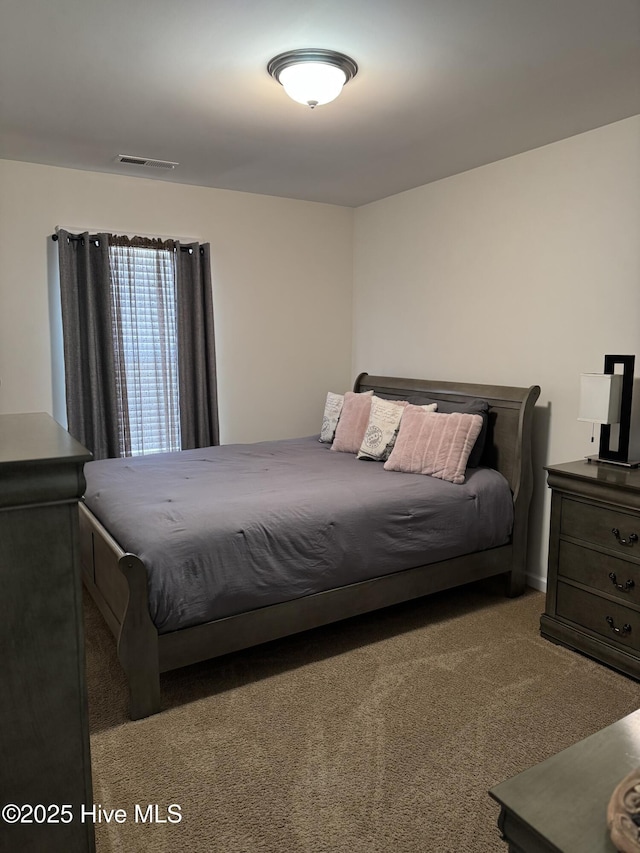 bedroom featuring carpet