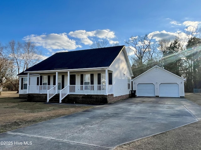 view of front of home featuring an outbuilding, a porch, and a garage