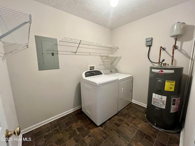 laundry room featuring electric water heater, a textured ceiling, electric panel, and washer and clothes dryer