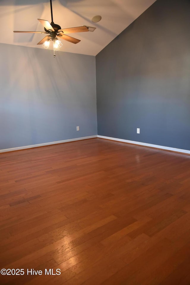 empty room featuring wood-type flooring, lofted ceiling, and ceiling fan