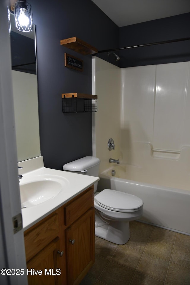 full bathroom with vanity, tile patterned flooring, shower / bathing tub combination, and toilet