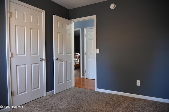 unfurnished bedroom with carpet flooring