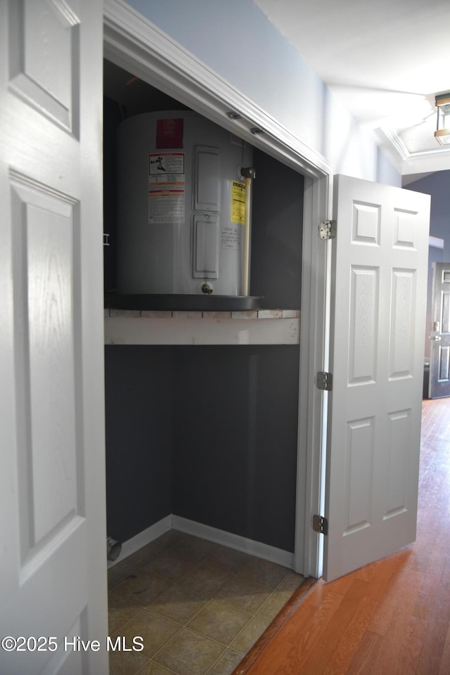 utility room featuring water heater