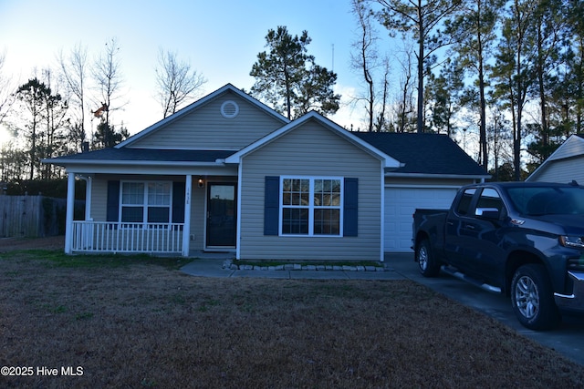 view of front of property with a porch and a garage