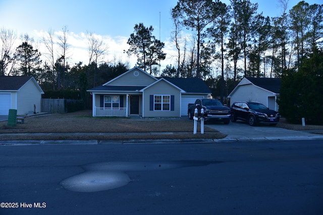 view of front of property featuring a garage and covered porch