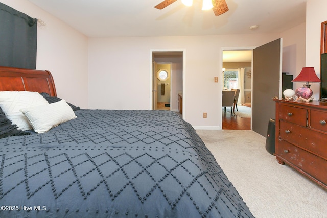 carpeted bedroom with a ceiling fan