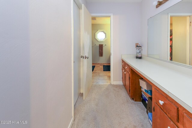 bathroom with visible vents, vanity, and baseboards