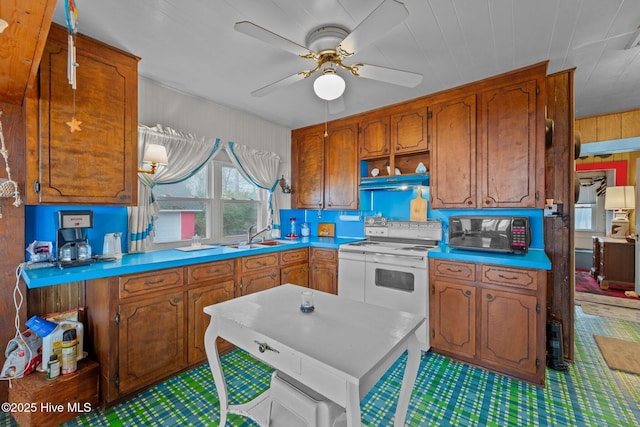 kitchen with ceiling fan, white range with electric cooktop, and sink