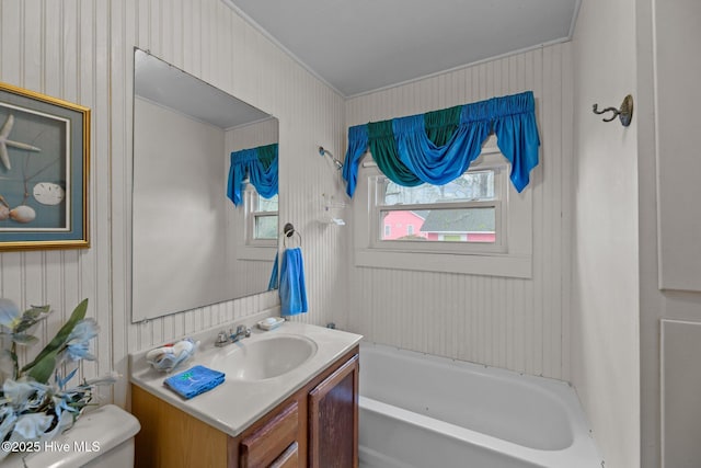 bathroom with vanity, a bathtub, and toilet