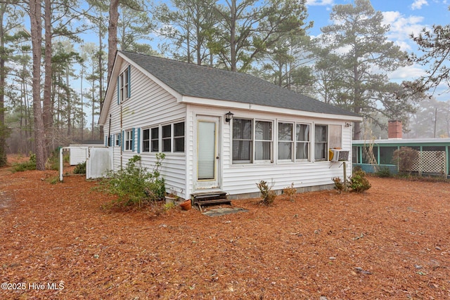 view of front of house featuring cooling unit