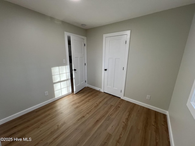 spare room featuring light hardwood / wood-style flooring