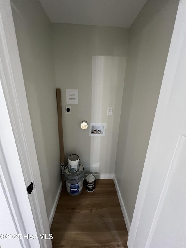 washroom with electric dryer hookup, hookup for a washing machine, and dark hardwood / wood-style floors