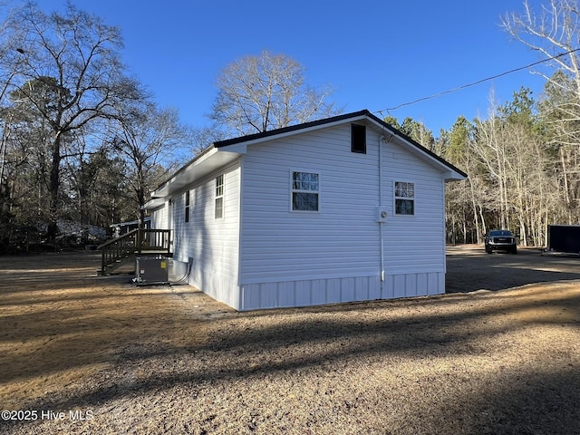 view of property exterior with central AC