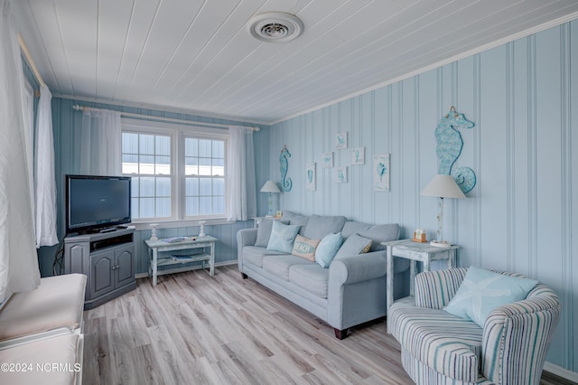 living room featuring light hardwood / wood-style flooring and wooden ceiling