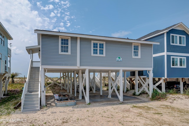 rear view of property with a carport