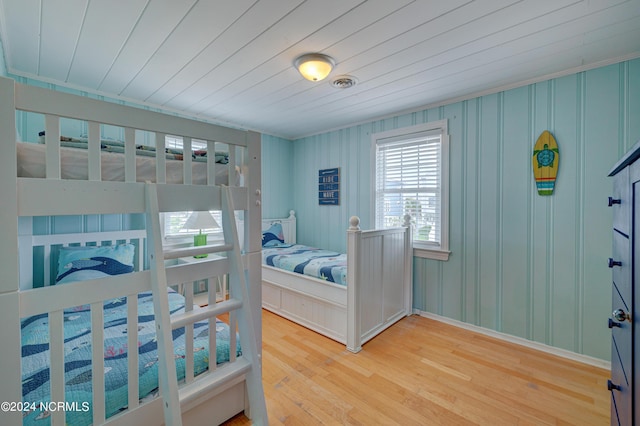 bedroom featuring hardwood / wood-style flooring and wood ceiling