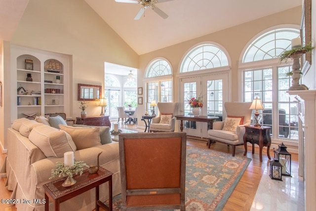 living room featuring plenty of natural light, light hardwood / wood-style floors, and ceiling fan