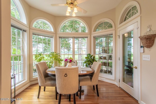 sunroom / solarium with ceiling fan