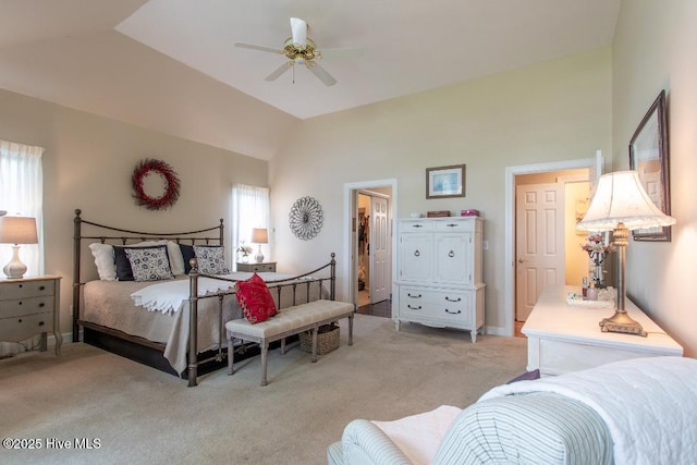 carpeted bedroom featuring multiple windows, lofted ceiling, and ceiling fan