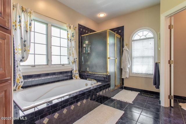 bathroom featuring tile patterned flooring and plus walk in shower