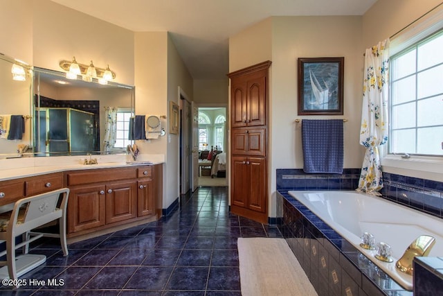 bathroom with vanity, shower with separate bathtub, and tile patterned flooring