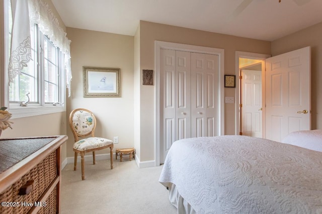 carpeted bedroom with a closet