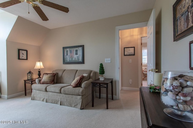 living room with vaulted ceiling, light colored carpet, and ceiling fan