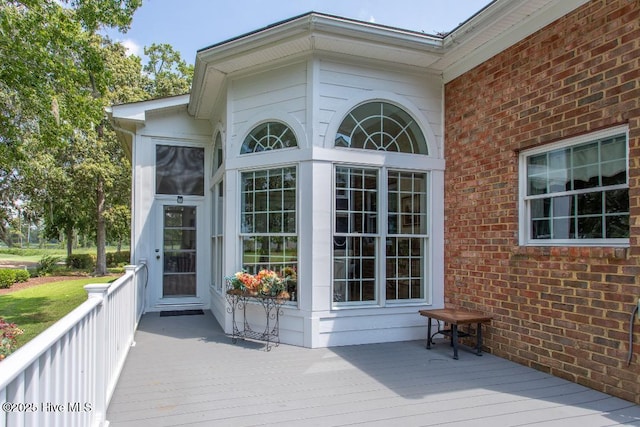 doorway to property featuring a wooden deck