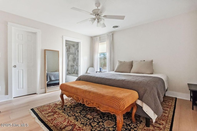 bedroom with ceiling fan and light wood-type flooring