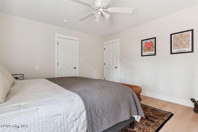 bedroom featuring hardwood / wood-style flooring and ceiling fan