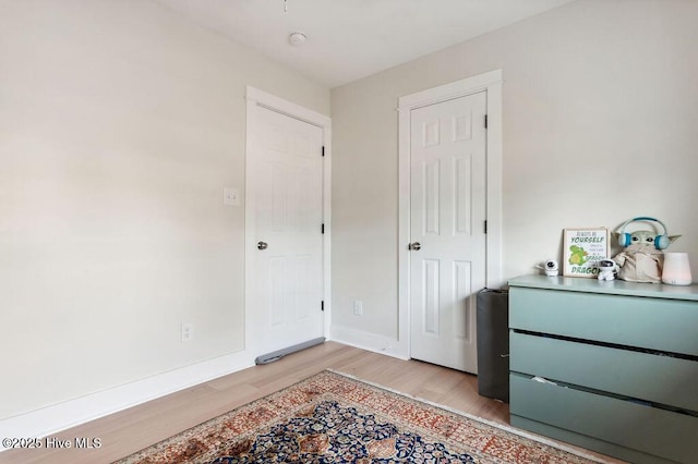 bedroom with light wood-type flooring