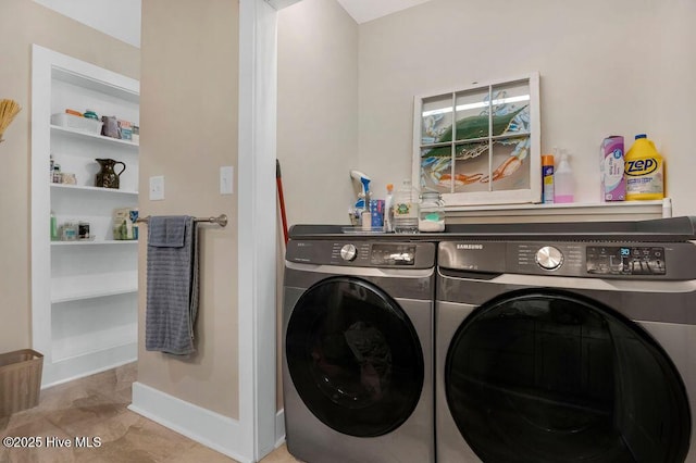 laundry room with washing machine and dryer