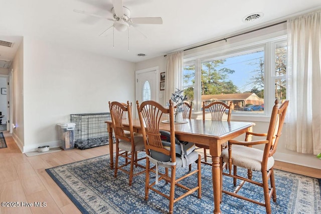 dining area featuring light hardwood / wood-style flooring and ceiling fan