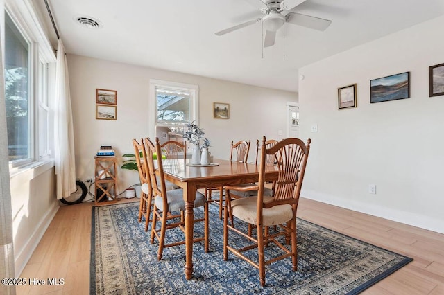 dining space featuring hardwood / wood-style floors and ceiling fan