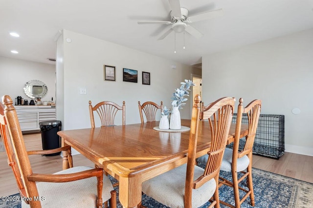 dining area featuring hardwood / wood-style floors and ceiling fan