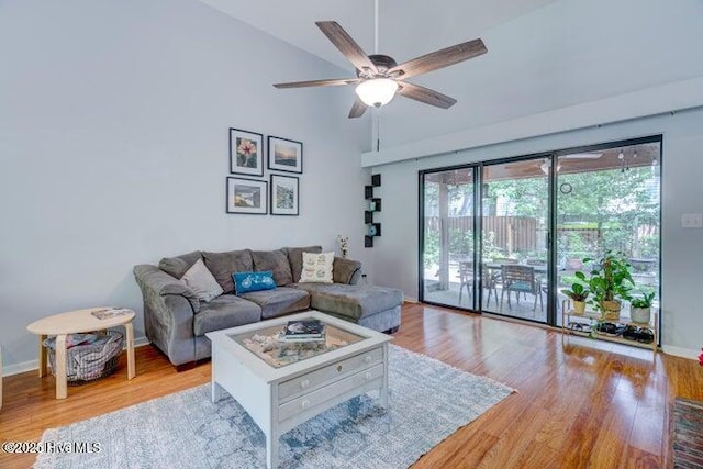 living room featuring ceiling fan and light hardwood / wood-style flooring