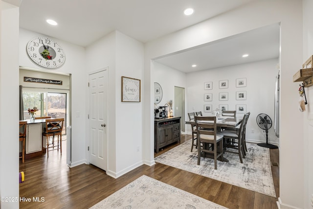 dining room with dark wood-type flooring