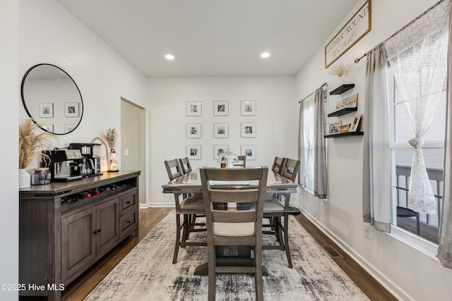 dining room featuring dark wood-type flooring