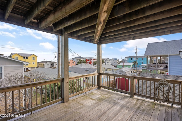 wooden deck with a residential view