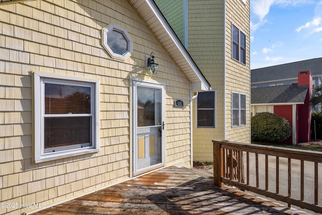 entrance to property featuring a deck